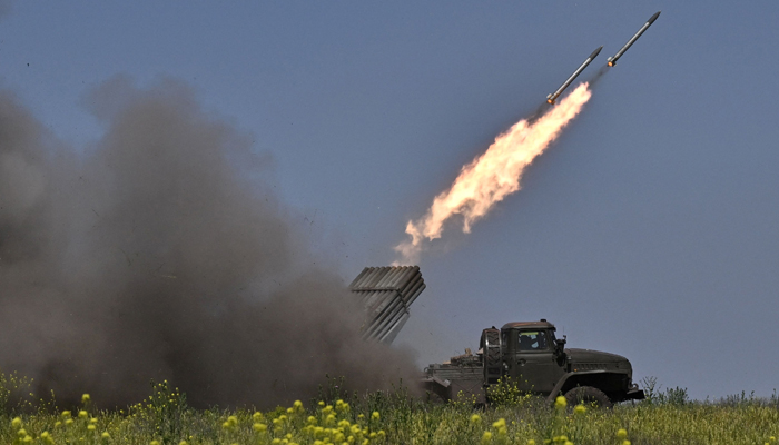 Ukrainian servicemen of the 57th Brigade fire BM-21 Grad multiple rocket launcher towards Russian positions at a front line near Bakhmut in the Donetsk region on June 20, 2023. — AFP