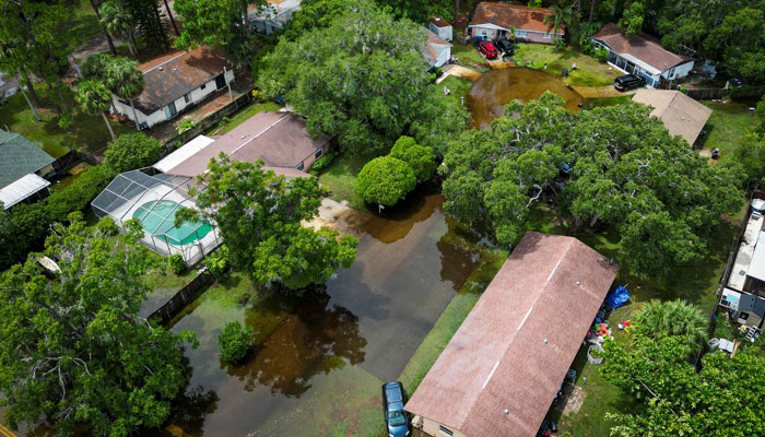 An aerial view shows a flooded community in New Port Richey, Florida, on August 30, 2023, after Hurricane Idalia made landfall earlier in the day. Idalia slammed into northwest Florida as an extremely dangerous Category 3 storm early Wednesday, buffeting coastal communities with cascades of water as officials warned of catastrophic flooding in parts of the southern US state. AFP