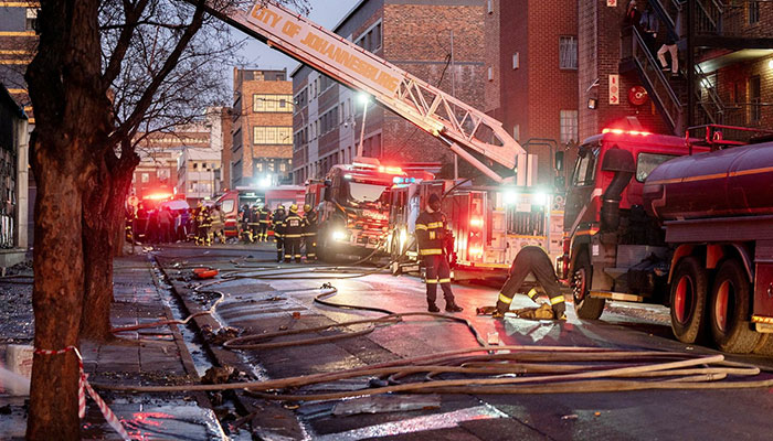 Firefighters work at the scene of a deadly blaze. — Sky News/File