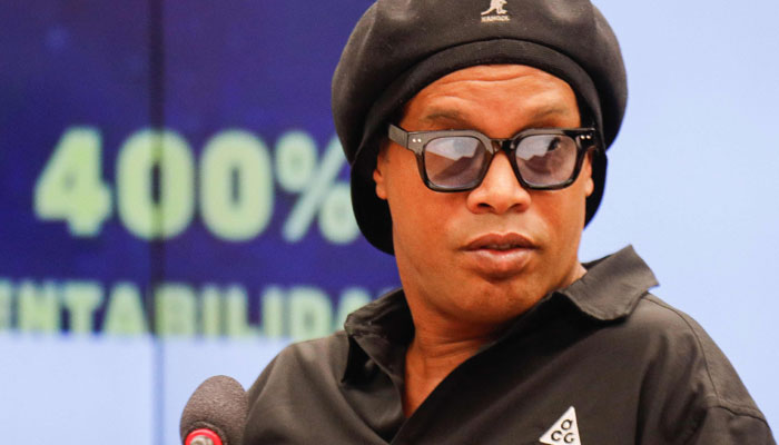 Brazilian former football star Ronaldinho (C) gestures during a session of the Parliamentary Commission of Inquiry to give his testimony on cryptocurrencies at the Chamber of Deputies in Brasilia, on August 31, 2023. AFP