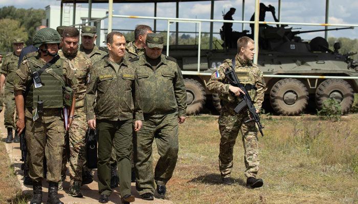 Deputy Chairman of the Security Council of Russia Dmitry Medvedev (3rd L) visits the Totsky military training field outside Siberian city of Orenburg, on July 14, 2023. — AFP