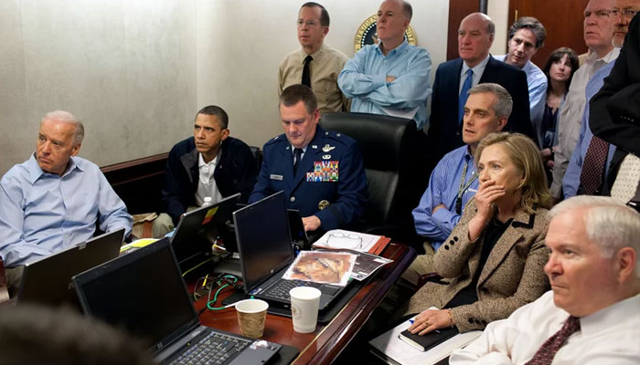 President Barack Obama, Vice President Joe Biden, Secretary of State Hillary Rodham Clinton and other members of his national security team as they monitored the mission that ended with the death of Osama bin Laden in May 2011.—The White House