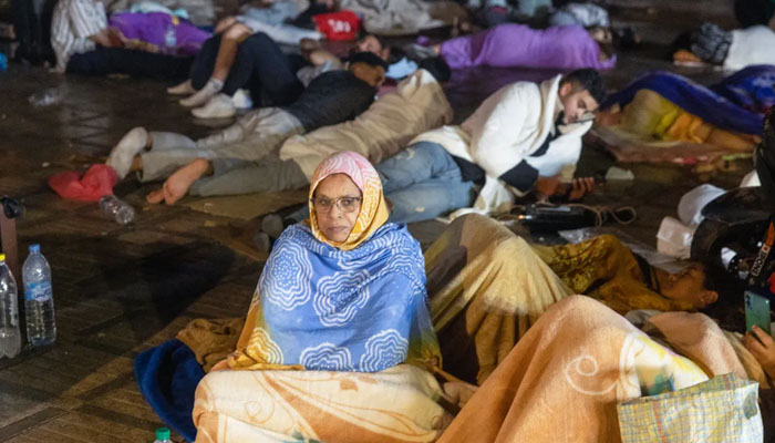 Residents take shelter outside in Morocco (Marrakesh) after the magnitude 6.8 temblor hit late on Friday. — AFP
