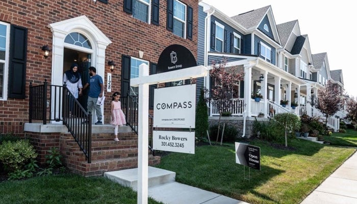 Prospective home buyers leave a property for sale during an Open House in a neighborhood in Clarksburg, Maryland on September 3, 2023. Homeownership feels increasingly out of reach for younger generations of Americans, who are squeezed by student debt and childcare costs in an era of slower economic growth. AFP/File