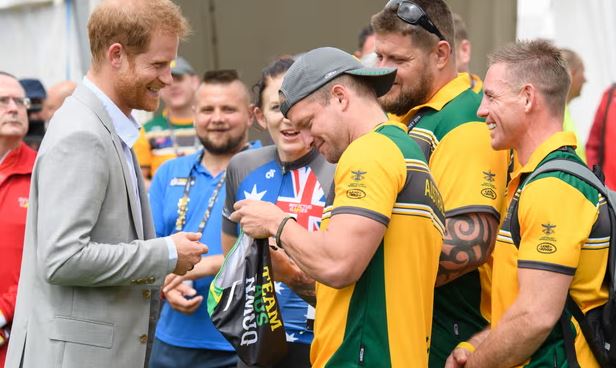 Prince Harry presented with swim trunks at the 2018 Invictus Games