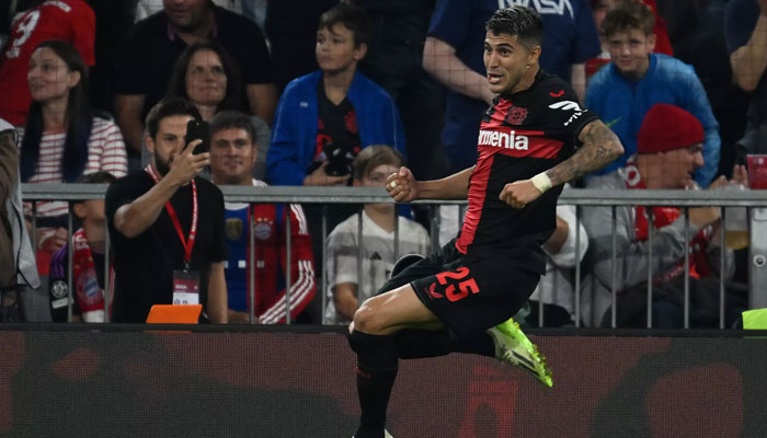 Bayer Leverkusen midfielder Exequiel Palacios celebrates scoring an injury-time penalty to snatch a draw at Bayern Munich. AFP