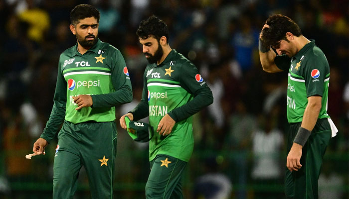 Pakistan´s captain Babar Azam (L) and team mates react as they walk back to the pavilion after Sri Lanka´s victory by 2 wickets after the Asia Cup 2023 Super Four one-day international (ODI) cricket match between Sri Lanka and Pakistan at the R. Premadasa Stadium in Colombo early September 15, 2023. — AFP