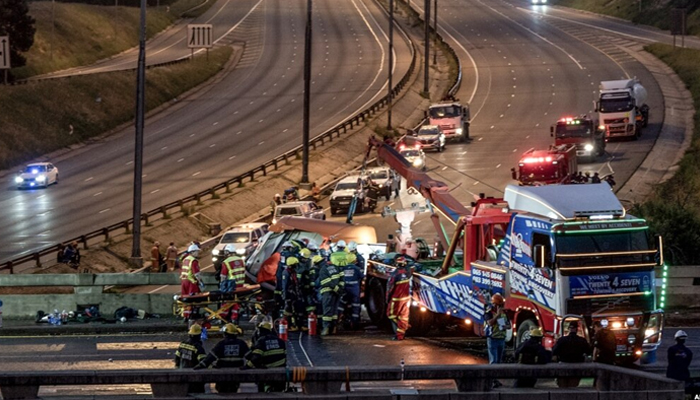 Paramedics and emergency service personnel work on the scene of a diesel tanker crash on the N12 highway in Johannesburg, January 7, 2023. — AFP