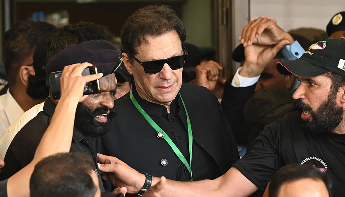 Pakistan Tehreek-e-Insaf (PTI) Chairman Imran Khan leaves after appearing in the Supreme Court in Islamabad on July 24, 2023. — AFP