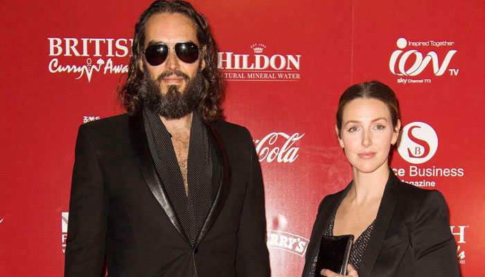 How is Russel Brand’s wife dealing with husband’s rape allegations?