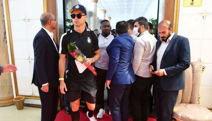 This handout picture provided by the media office of Iranian football club Persepolis Monday shows Al-Nassrs Cristiano Ronaldo arriving at Tehrans Imam Khomeini International Airport. — AFP