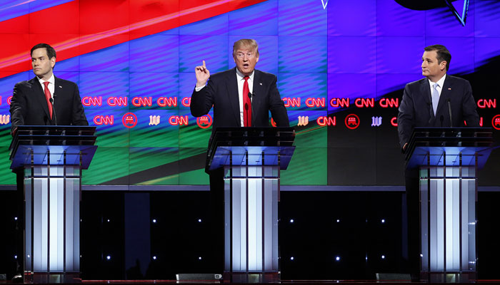 Republican presidential candidate, businessman Donald Trump, center, speaks as candidates, Sen. Marco Rubio, R-Fla., left, and Sen. Ted Cruz, R-Texas, right, listen, during the Republican presidential debate sponsored by CNN, Salem Media Group and the Washington Times at the University of Miami, Thursday, March 10, 2016, in Coral Gables, Fla. news.northeastern.edu