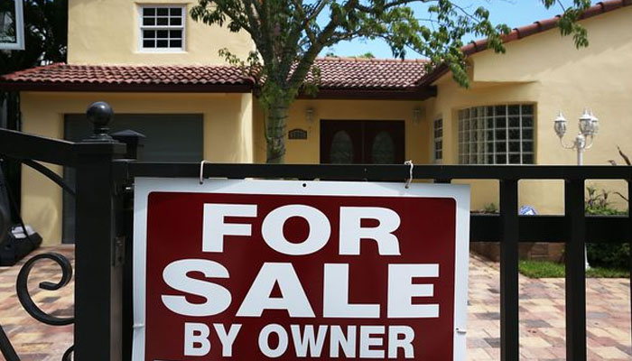A For Sale sign is seen in front of a home on August 21, 2015 in Miami, Florida. — AFP