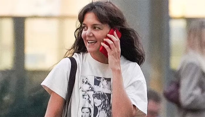Katie Holmes in NYC while sporting Taylor Swift Eras Tour t-shirt.