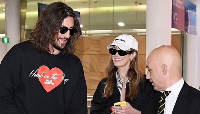 Delta Goodrem and Matthew Copley newly engaged bliss upon arrival in Sydney.