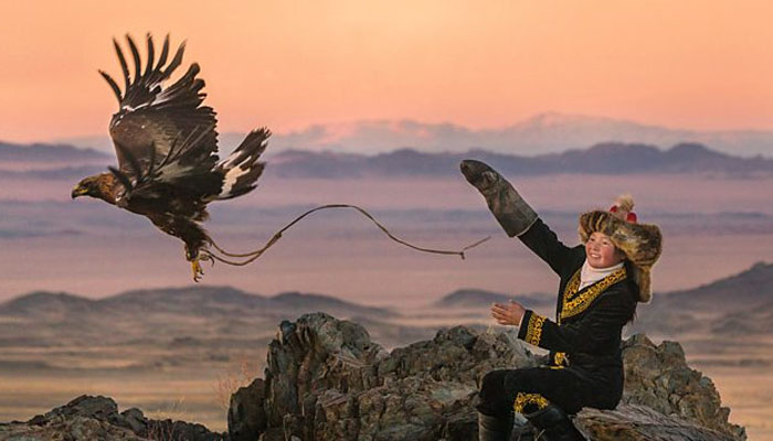 Aisholpan, a 13-year-old eagle huntress from a remote Mongolian tribe, — Twitter @theeaglehuntress