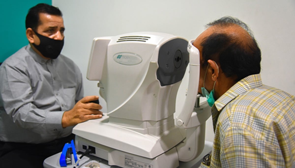 A doctor tests a patient at an eye clinic. — APP