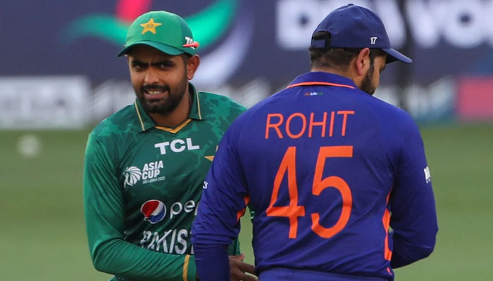 Pakistan skipper Babar Azam shakes hands with Indian captain Rohit Sharma in a World Cup 2022 match. — AFP/File