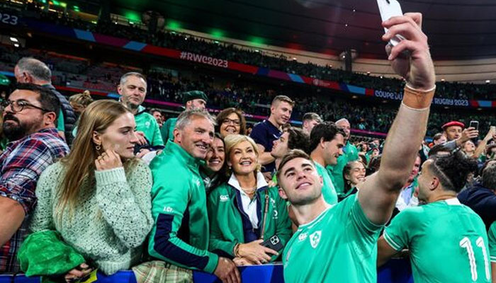 Ireland’s Jack Crowley takes a selfie with his father Fachtna, mother Maria, and sister Tessa after the game. irishexaminer.com/