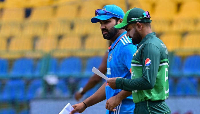India´s captain Rohit Sharma (left) and Pakistan´s skipper Babar Azam arrive for the toss before the start of the Asia Cup 2023 super 4 ODI  match between India and Pakistan in Colombo on September 10, 2023. — AFP