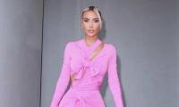 Kim Kardashian attends Victoria Beckham’s Paris fashion show in slinky gown