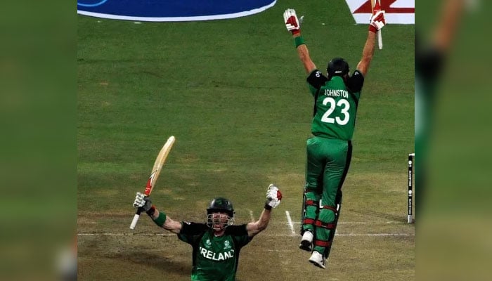 John Mooney and Trent Johnston celebrate their shocking win against England in the World Cup 2011 in Bengaluru, India on March 2, 2011. — AFP
