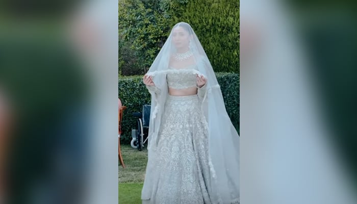 Mahira Khan walks down the aisle on her wedding with businessman Saleem Karim in this still taken from a video. — Instagram/@anushaytkhan