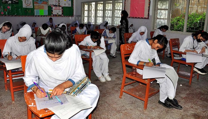 Students solve papers during the matriculation examinations on May 8, 2023. — APP