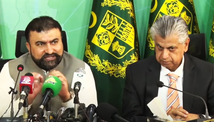 Caretaker Interior Minister Sarfraz Bugti (left) addressing a press conference in Islamabad, on October 2, 2023, in this still taken from a video. — YouTube/PTVNewsLive
