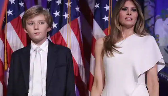Melania Trump with her son Barron Trump during an official gathering. — AFP