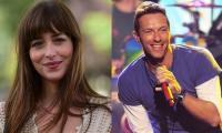 Dakota Johnson cheers for boyfriend Chris Martin at Coldplay concert