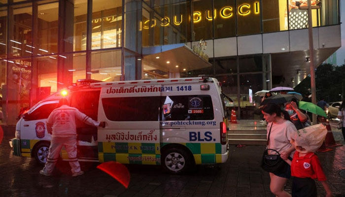 An ambulance outside a Bangkok shopping mall after a deadly shooting. — AFP