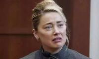 Amber Heard still needs crutch to walk after injuring hip during training
