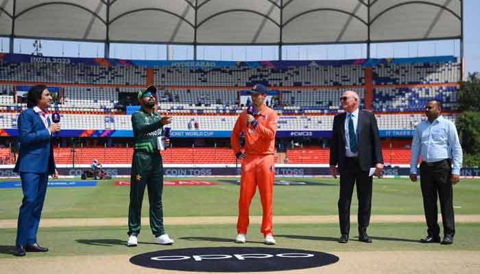 Pakistan skipper Babar Azam and Netherlands captain Scott Edwards at the toss at the Rajiv Gandhi International Stadium in Hyderabad, India. — PCB
