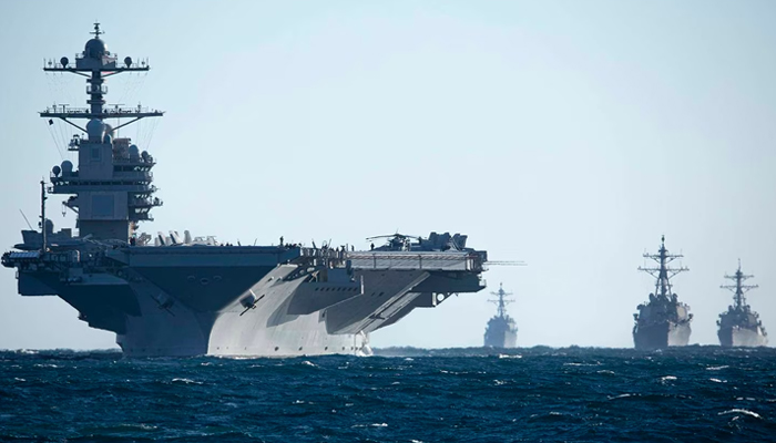 The aircraft carrier Gerald R. Ford and destroyers Thomas Hudner, Ramage and McFaul conduct a drill while underway in the Atlantic Ocean as part of the Gerald R. Ford Carrier Strike Group on March 5, 2023. — AFP