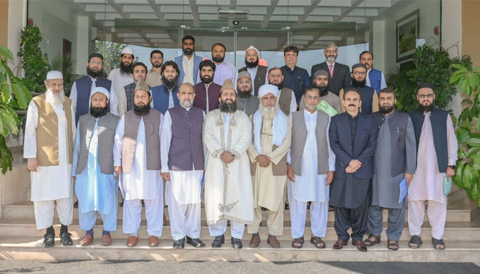 PTA officials and religious scholars pose for a picture at the PTA headquarters, Islamabad. — PTA