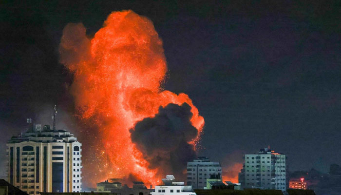 A fireball erupts from an Israeli airstrike in Gaza City on October 9, 2023. — AFP