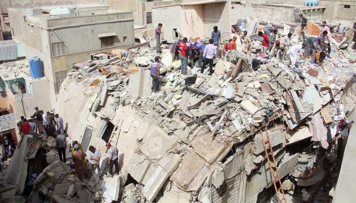 Rescue works are conducted after three residential buildings collapsed killing 23 people in Karachis Golimar area in provincial capital. Photo: Online/File