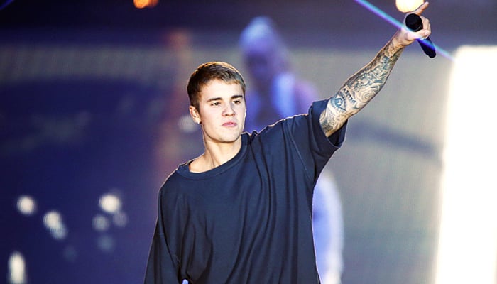 Justin Bieber while interacting with the audience in a music concert. — AFP/File