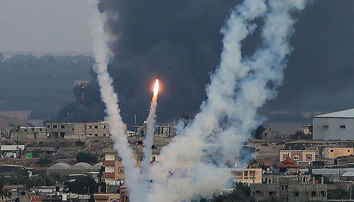 Palestinian militants fire rockets toward Israel from Rafah, southern Gaza Strip, on Oct. 11, 2023. — AFP