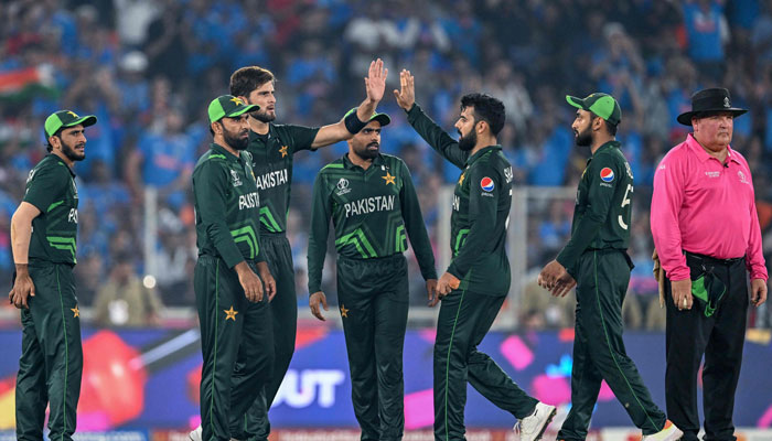 Pakistan´s Shaheen Shah Afridi (centre) celebrates with teammates after taking the wicket of India´s captain Rohit Sharma during the 2023 ICC Men´s Cricket World Cup ODI match between India and Pakistan at the Narendra Modi Stadium in Ahmedabad on October 14, 2023. — AFP