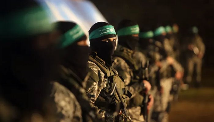 Palestinian members of the al-Qassam Brigades, the armed wing of the Hamas movement, take part in a gathering in Gaza City to pay tribute to their fellow militants who died after a tunnel collapsed in the Gaza Strip. — AFP/File