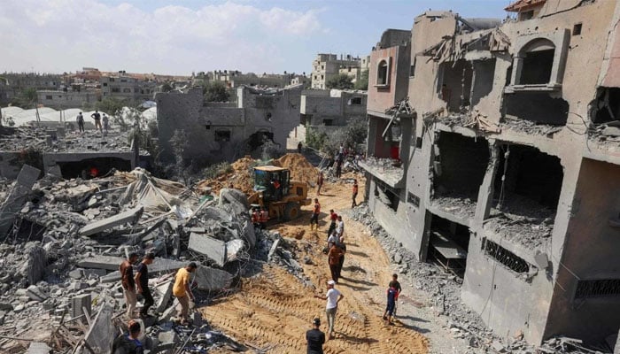 Palestinians search for victims under rubble after Israeli strikes on Rafah in southern Gaza this week. — AFP