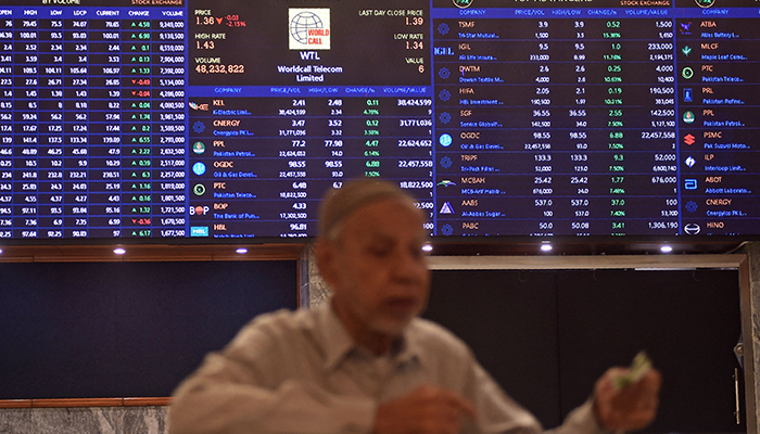 A stock broker watches share prices during a trading session at the Pakistan Stock Exchange (PSX) in Karachi on July 31, 2023. — AFP