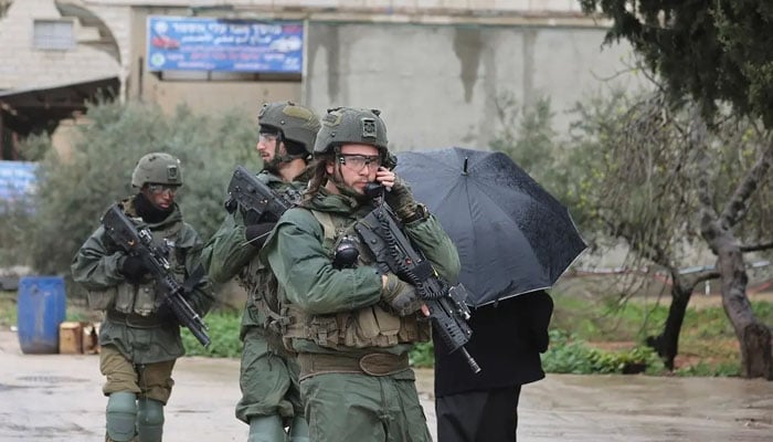 Israeli soldiers patrol Huwara in the occupied West Bank, on March 20, 2023. — AFP