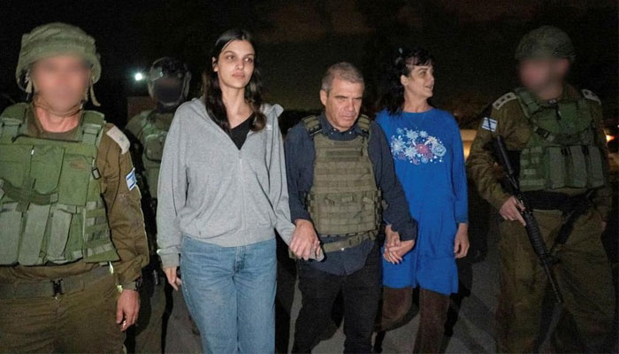 This handout picture courtesy of the government of Israel taken on October 20, 2023, shows Natalie Shoshana Raanan (2nd L) and Judith Tai Raanan (2nd R) after being held hostage and later released by Hamas at an undisclosed location. — AFP