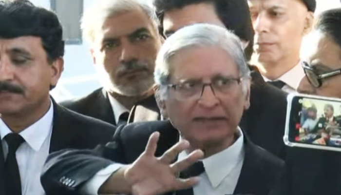 Aitzaz Ahsan, one of the petitioners in the military trial case, speaks to journalists outside the Supreme Court in Islamabad, on October 23, 2023, in this still taken from a video. — YouTube/GeoNews