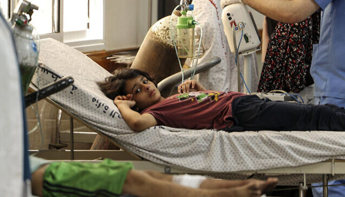 Palestinian child injured in the aftermath of Israeli air strikes receive treatment at al-Shifa hospital in Gaza City. — AFP/File