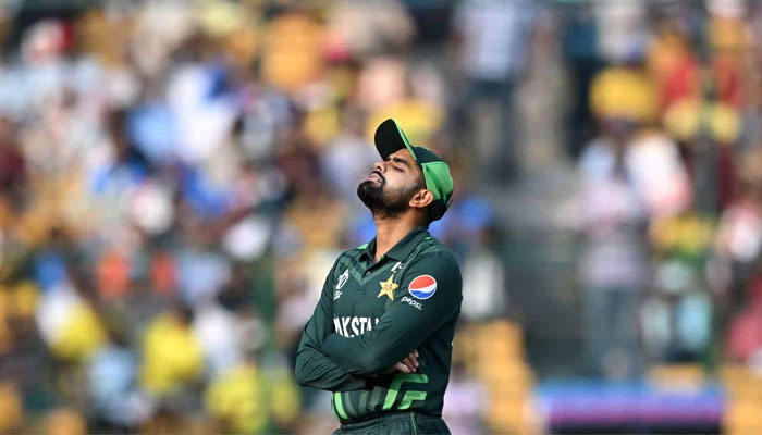 Pakistan´s captain Babar Azam reacts while fielding during the 2023 ICC Men´s Cricket World Cup match between Australia and Pakistan at the M. Chinnaswamy Stadium in Bengaluru on October 20, 2023. — AFP