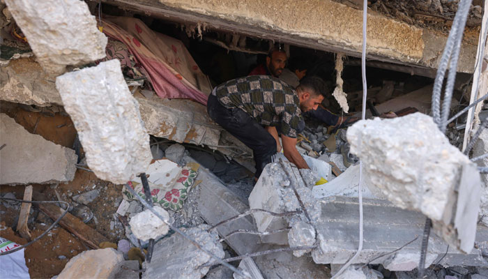People search the rubble of a building following Israeli strikes on Rafah in the southern Gaza Strip on October 24, 2023, amid ongoing battles between Israel and Palestine. — AFP